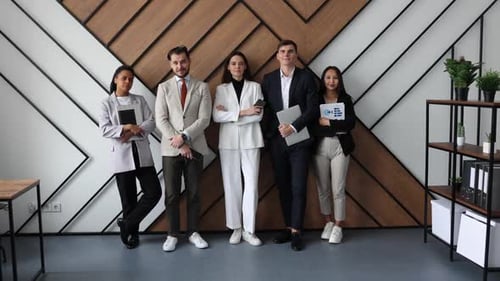 Diverse Team of Professionals Standing Together in Office