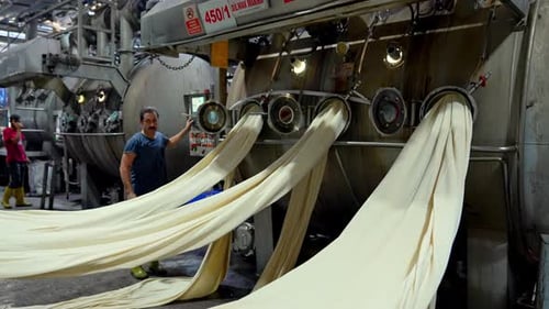 Human Labor in Textile Fabric Processing at Factory