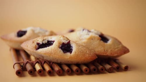 Deliciously Freshly Baked Cookies Filled with Juicy Berries on a Charming Rustic Wooden Tray