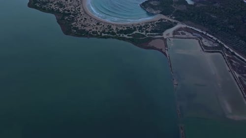 Aerial view of voidokilia beach at sunset, Greece.
