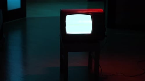 Vintage Red Television in Dimly Lit Room