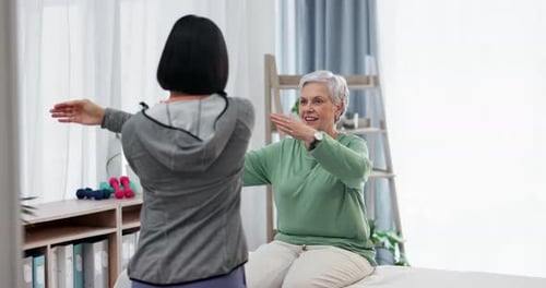 Senior Woman Stretching with Physical Therapist