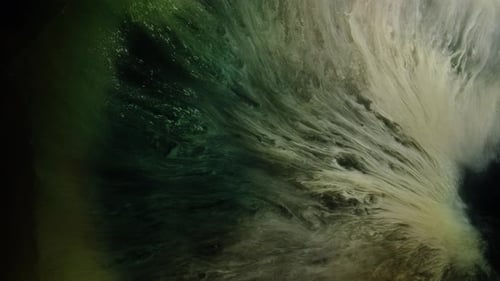 Nephos Collection: Whitish green abstract waves sweep out from bottom right corner on dark backgroun