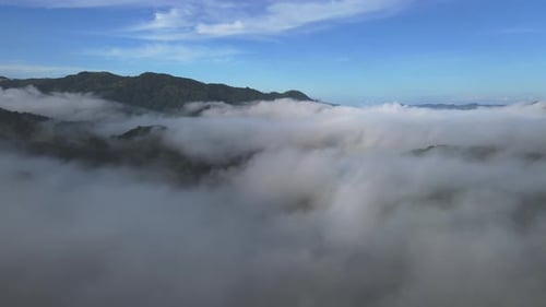 Drone 4K Through Clouds In Blue Sky Above Mountain Peak In Costa Rica
