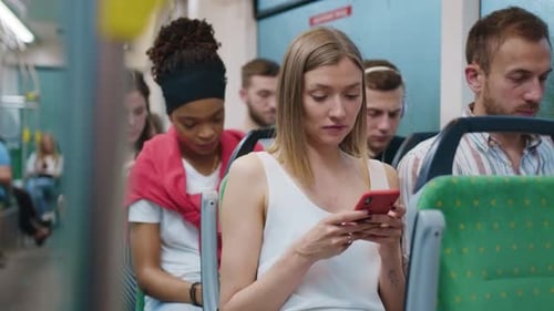 People Riding Bus, Using Cell Phones in City