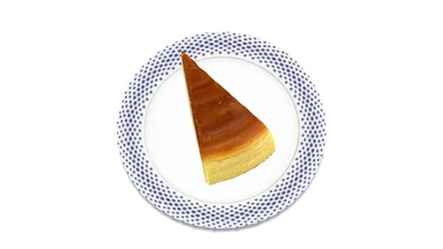 Rotating Cheesecake Slice on White Background