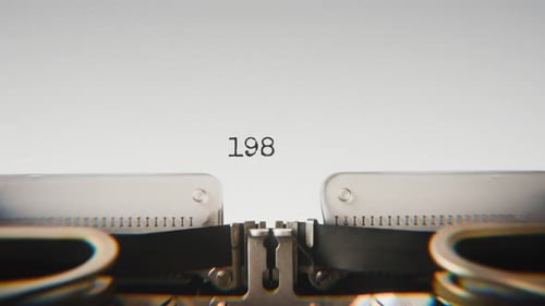 Old mechanical typewriter typing Year 1986 in a close-up view.