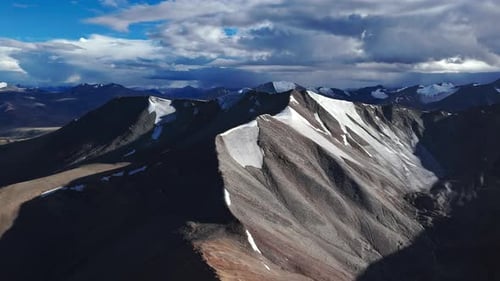 High Altitude Ridge with Snow Patches