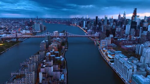 The Queensboro Bridge crossing the East River connecting Manhattan to Queens.