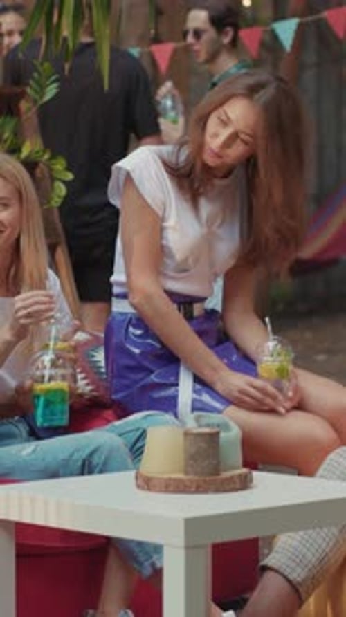Friends Enjoying Refreshments at an Outdoor Celebration