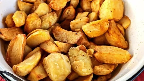 Bowl of Delicious Fried Potato Wedges Close Up