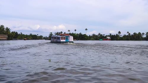 water boat running in sea backwater with cloudy sky at morning video taken at Alappuzha or Alleppey