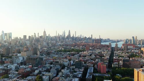 Aerial View of New York City's Skyline During Sunset Highlighting Iconic Landmarks and Serene