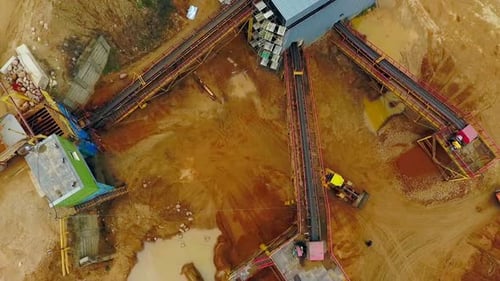 Excavator Loader in Sand Quarry. Aerial View Dumper Trucks with Cargo Sand