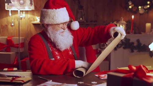 Santa Claus Checking His List Indoors at Night