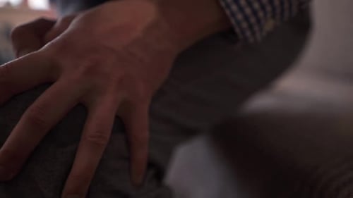 Close Up of Hands Massaging an Injured Knee or Joint Legs