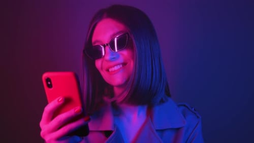 Woman Selfportrait Shot Stylish Caucasian Woman in Neon Studio Engaging on Social Media with Vibrant