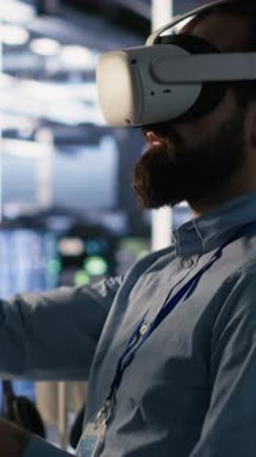 Vertical Video Data Center Technician Using VR Headset to Monitor Neural Networks