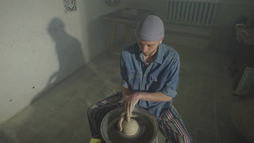 The Art of Ceramics Master Artist Works in Craft Workshop on a Potter's Wheel