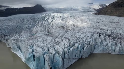 Aerial view of the beautiful iceberg-filled lagoon of Fjallsárlón in Iceland from the beginning of t