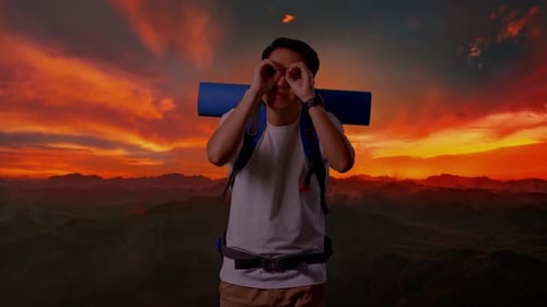 Asian Male Smiling And Making Binoculars Gesture Then Looking Around On Top Mountain