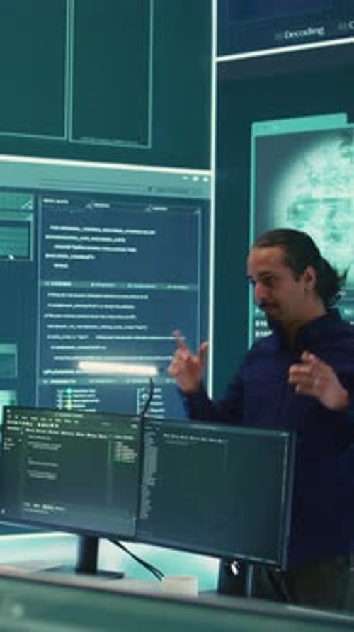 Team Discussing Programming Code in Office