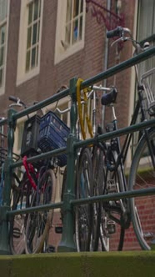 Establishing Shot Amsterdam Picturesque Cityscape View Old Houses Along the Canal People Cycling