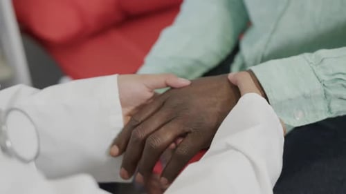 Doctor Holding Patient Hand in Support and Care
