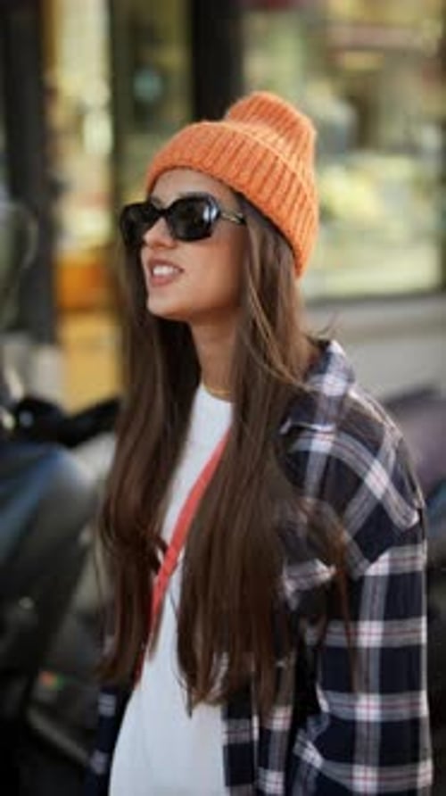 Stylish Woman Walking on City Sidewalk