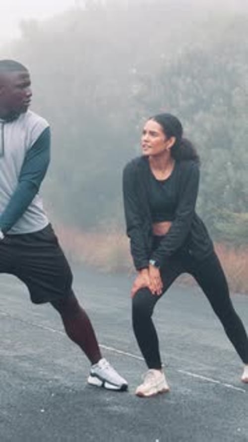 Mist, fitness or couple with stretching in road to start running, getting ready or exercise support