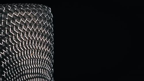 The Studio Condenser Microphone Rotates on a Black Background CloseUp