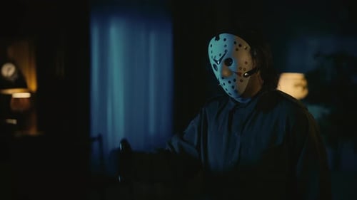 Masked Figure with Knife in Dimly Lit Room