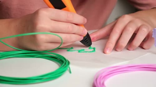 Child Creating Art with 3D Printing Pen