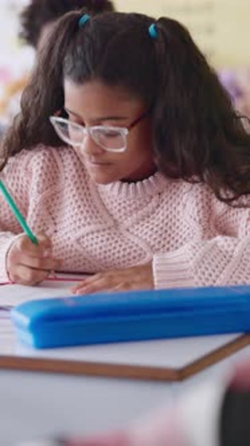 Girl, writing and exam at school with thinking, education or problem solving for maths quiz