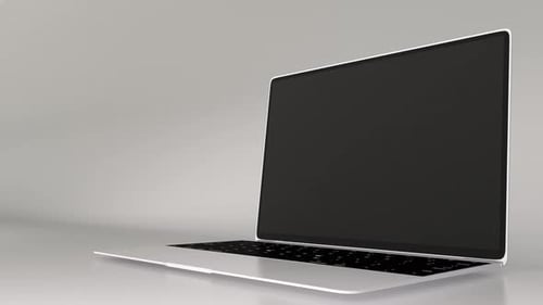A white laptop with a green screen on a white background. Laptop opens green chroma key display