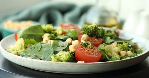 Healthy Salad of Chickpeas, Broccoli, Spinach, and Tomatoes