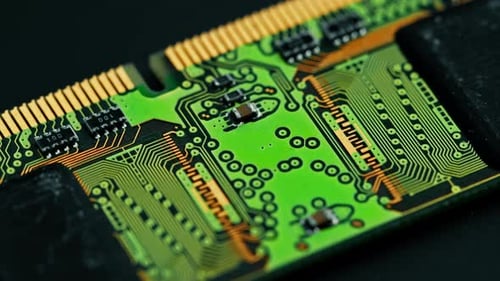 Green printed circuit motherboard components microchips CPU processor transistors semiconductors