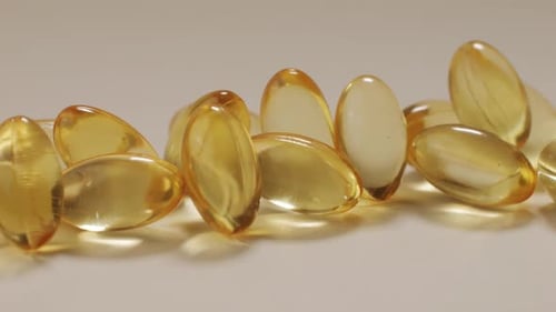 Omega Fish Oil Gel Capsules on Black Background Closeup Omega Vitamins Pills 3 6 9 To Be Healthy and