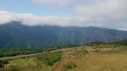 Scenic Mountains Winding Road and Serene Atmosphere Aerial View Green Valley
