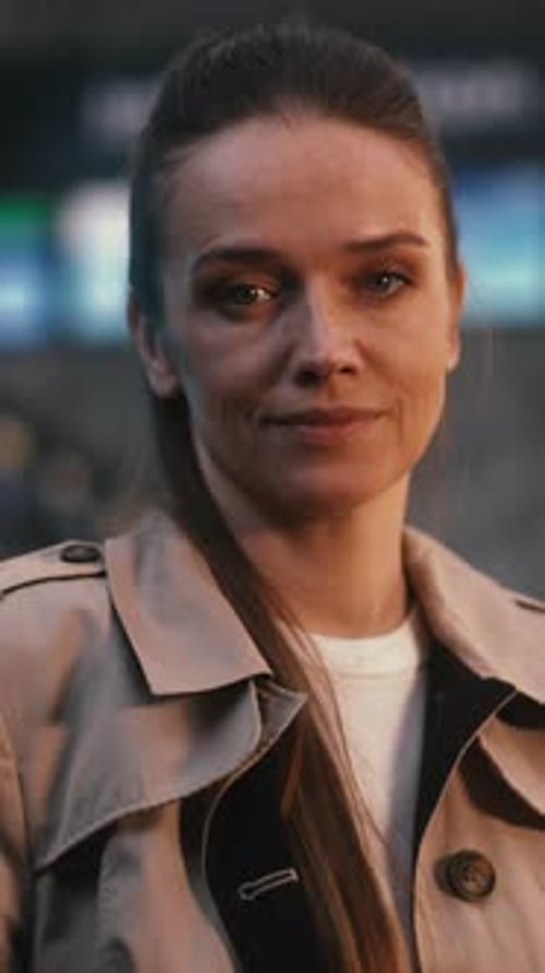 Confident Young Female Passenger Standing in Terminal with Smile