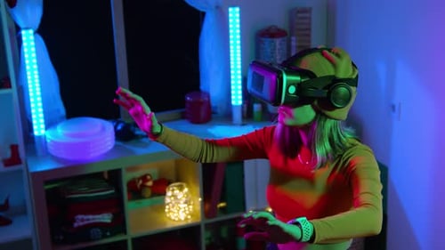 Woman Using Virtual Reality Headset in Dark Room