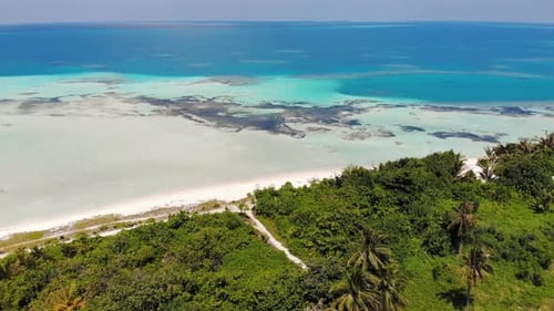 Maldivian Island Panorama Aerial View. Blue Ocean With Sand Shore