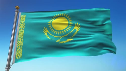 Waving Flag of Kazakhstan Against Blue Sky
