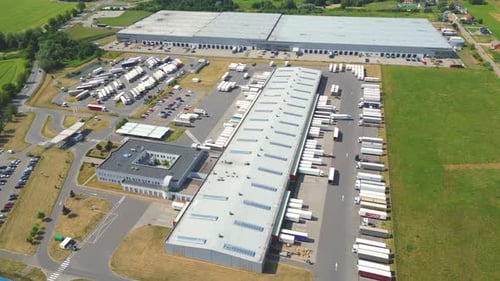 Aerial view of warehouse storages or industrial factory or logistics center from above. Aerial view