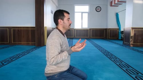 Man Praying on Knees, Indoors
