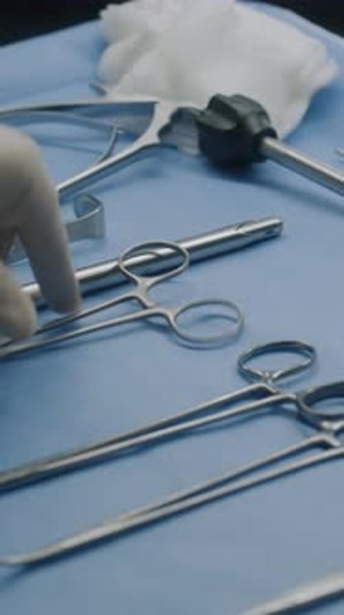Surgical Tools Laid Out on Blue Drape