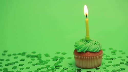 Shamrock Confetti Falling On St Patricks Day Cupcake