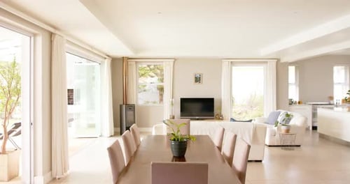 General view of light modern interiors with dining room table and chairs, copy space, slow motion