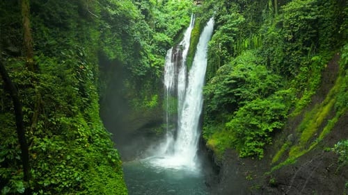 Aerial Drone View of Beautiful Aling Aling Waterfall in Nothern Bali Indonesia