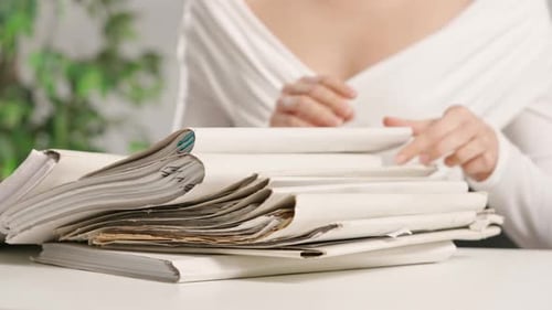 Woman Puts on Office Desk Files Sitting and Searching Through Overload Stack of Folders Full of
